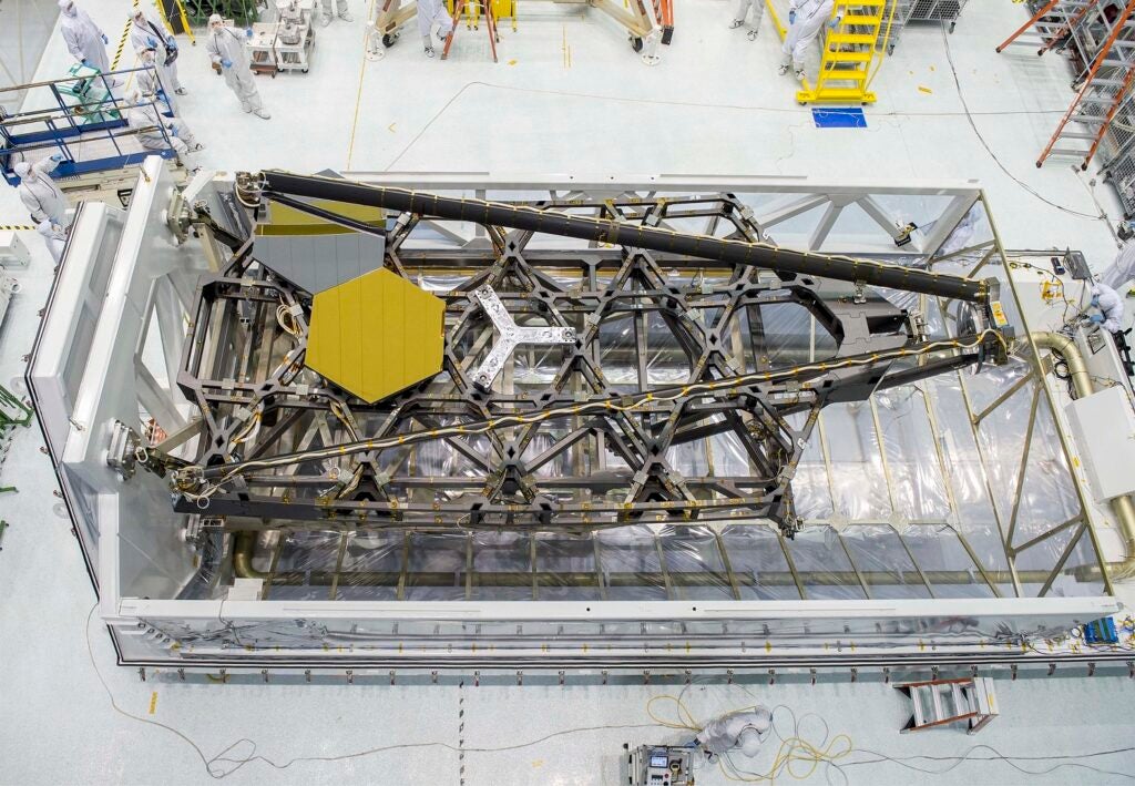 Metal backbone of James Webb Space Telescope with a single gold mirror inserted